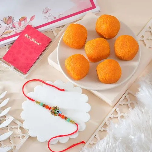 Elegant Peacock Rakhi with Delicious Motichoor Laddoos