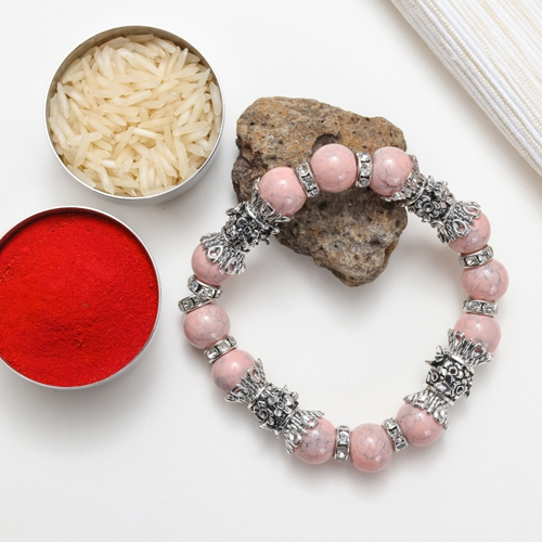 Bracelet Rakhi Adorned with Pink Stone