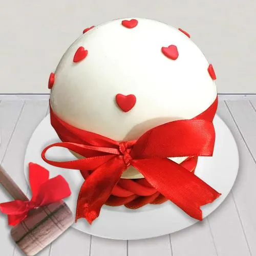 Delicious White Round Pinata Cake with Hammer