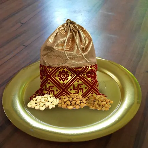 Shop Irresistible Dry Fruits Potli with Stylish Thali in Golden Color
