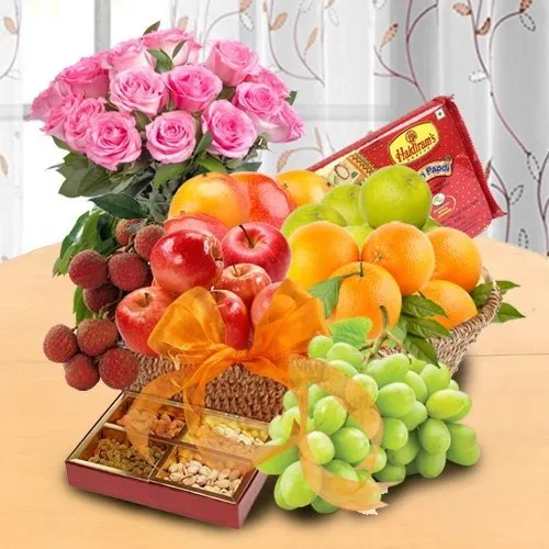 Order Mothers Day special basket of Fresh Fruits, Sweets and Pink Roses