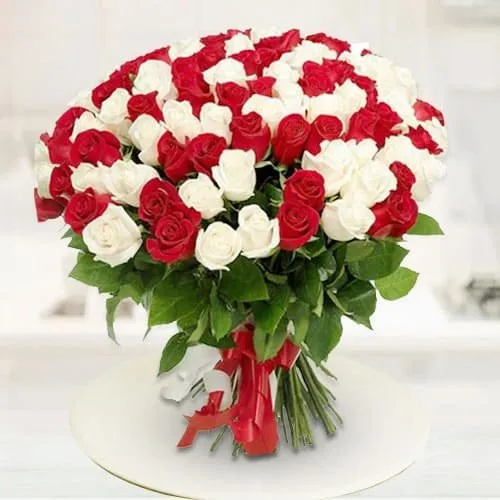 Order Glowing Marvel Red N White Roses Premium Bouquet