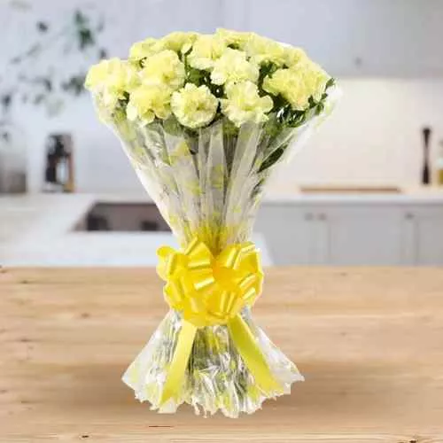 Deliver Hand Bouquet of Yellow Carnations Online in tissue wrapping