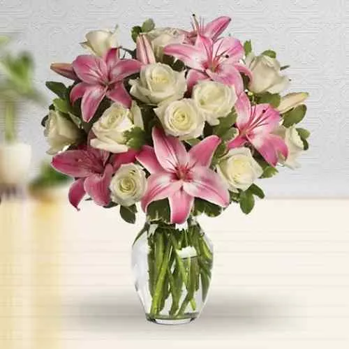 Buy Present of Pink Lilies with White Roses in Glass Vase