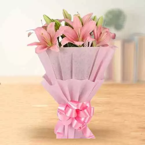 Order Beautiful Pink Lilies Bouquet wrapped in a Tissue