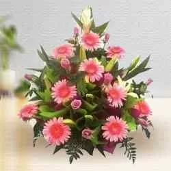 Pink Roses and Gerberas. with 500 grms Assorted Sweets.